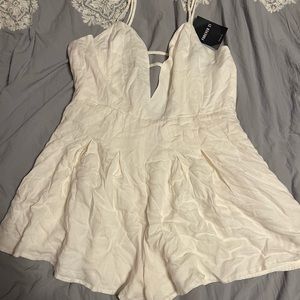 white romper, v neck with cutout, brand new w tags from forever 21, never worn